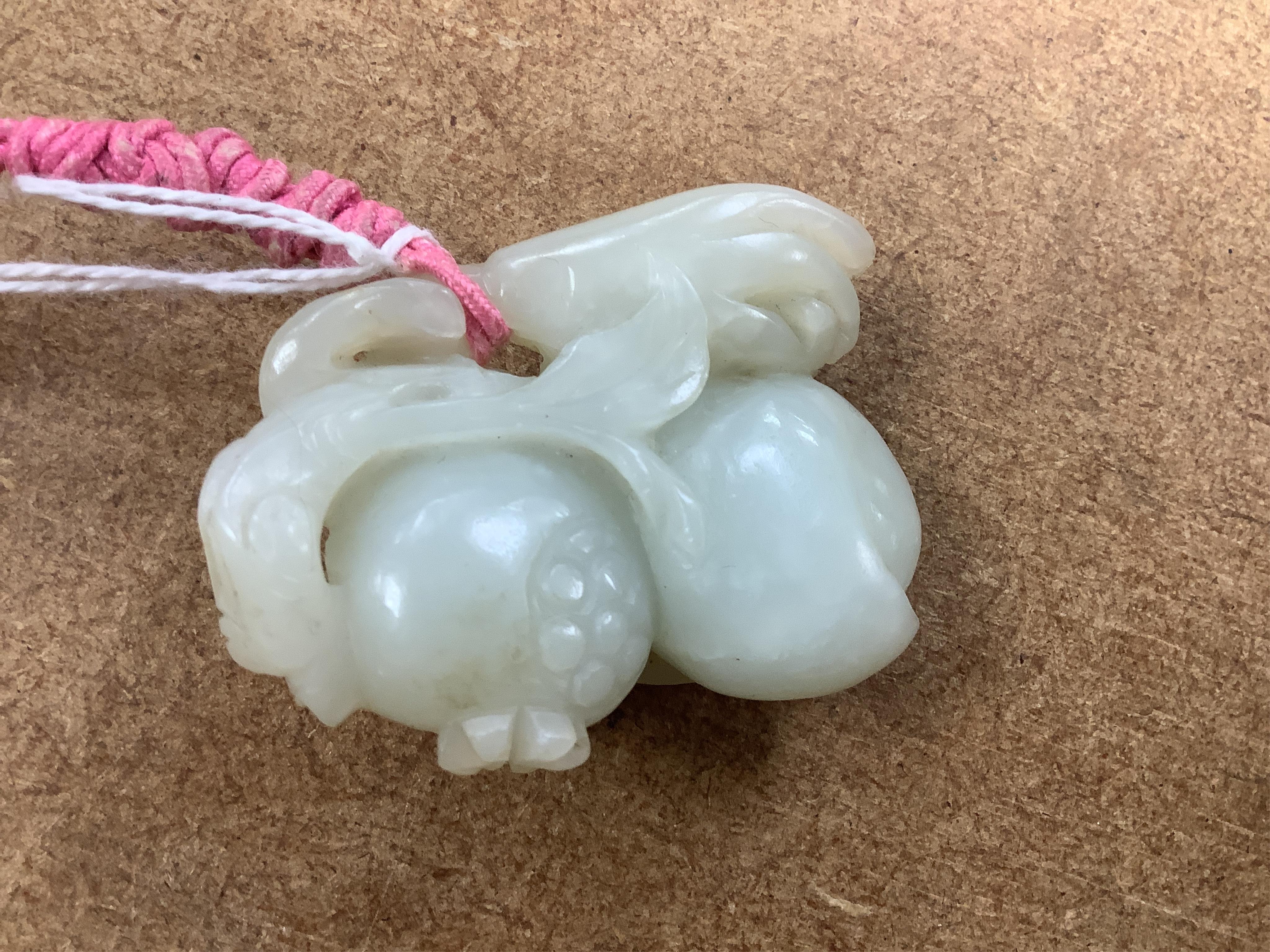 A 19th century jade carving of fruit, 5.5cm wide. Condition - fair, a small piece missing